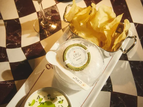 Cocktails and small plates on a chequered table at Owner’s Office