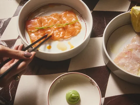 Shared seafood dishes on the Owner’s Office dining table