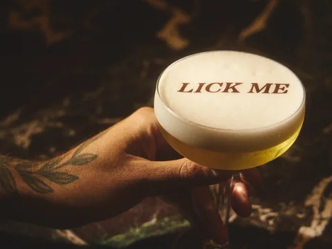 Lick Me cocktail held over the Owner’s Office bar