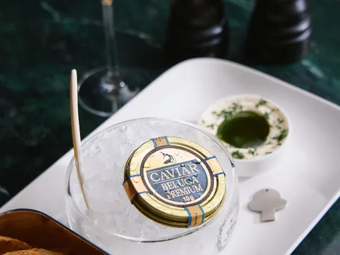 Caviar tin presented with accompaniments at The Room
