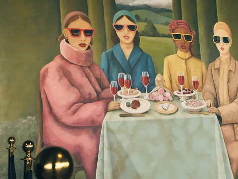 Colourful dining scene artwork displayed inside The Room