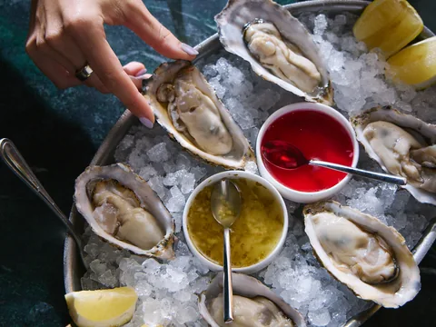 Oysters on ice with colourful sauces at The Room
