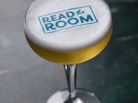 Cocktail topped with a Read the Room design