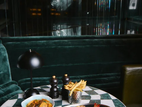 A spread of plated dishes on a table at The Room